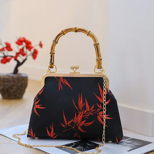 Black BAMBOO HANDLE HANDBAG with Red leaf accent